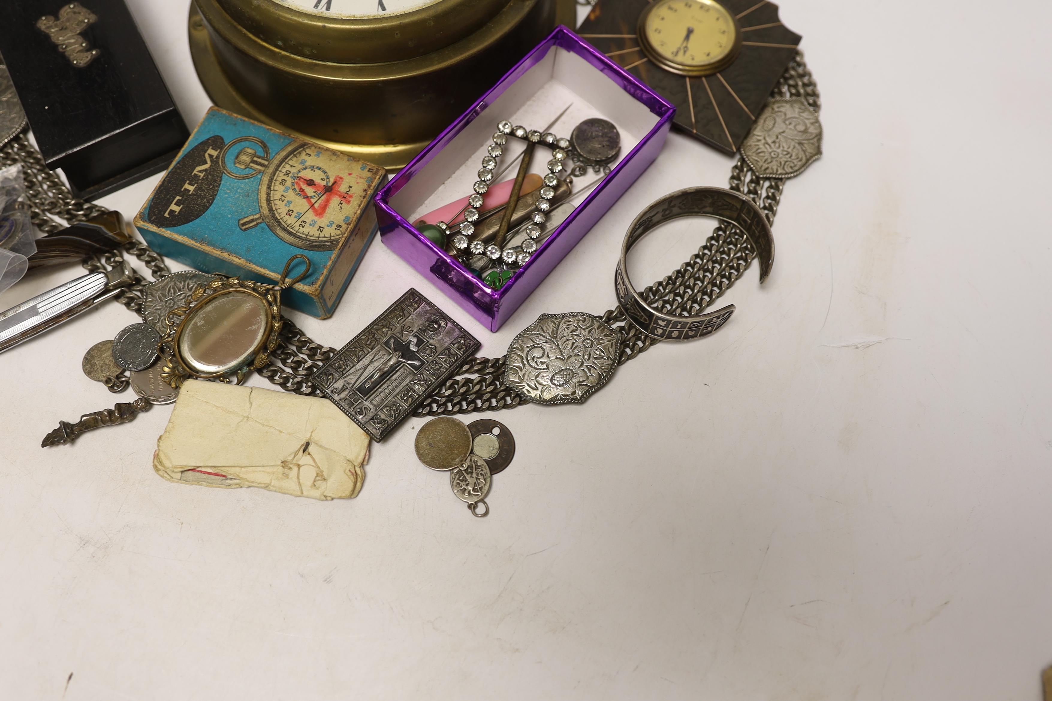 A quantity of mixed collectibles to include an eight day tortoiseshell and metal mounted travel clock, etc.